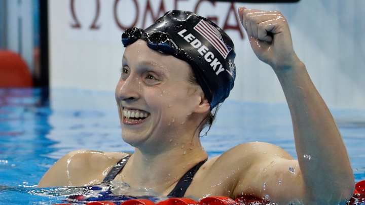 Katie Ledecky wins race by a full minute, shatters records