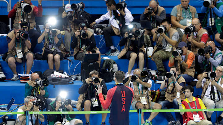 The Latest: Russians complain about torn flags at Olympics