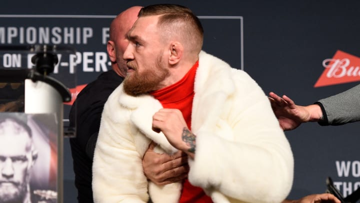 Watch: Conor McGregor nearly throws chair at Eddie Alvarez during press conference