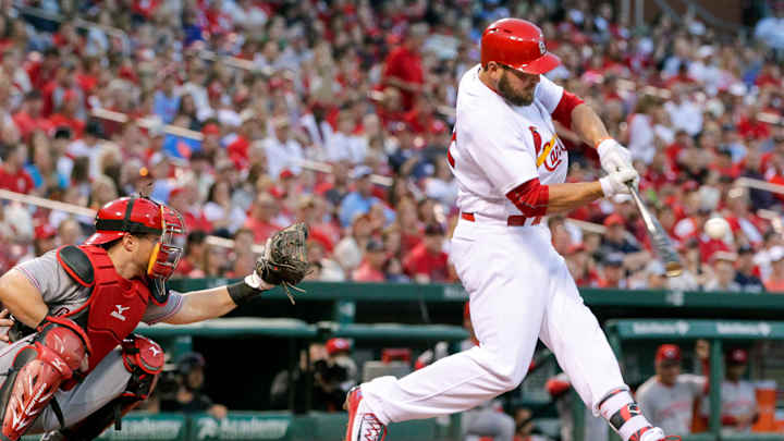Cards belt 6 homers, 2 by Holliday, in 14-3 win over Reds