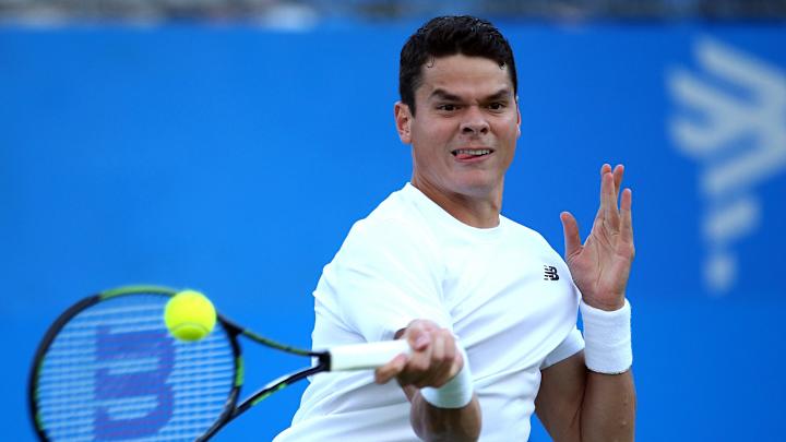 Raonic dominates after bad light to beat Kyrgios at Queen's