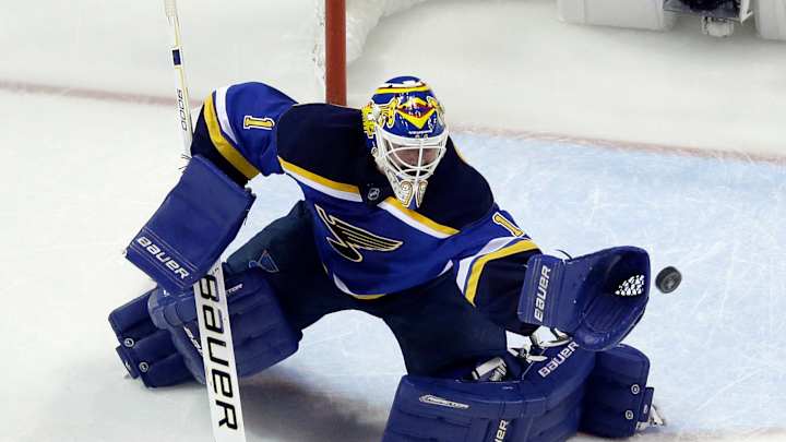 Flames acquire goalie Elliott from Blues for 2nd-round pick