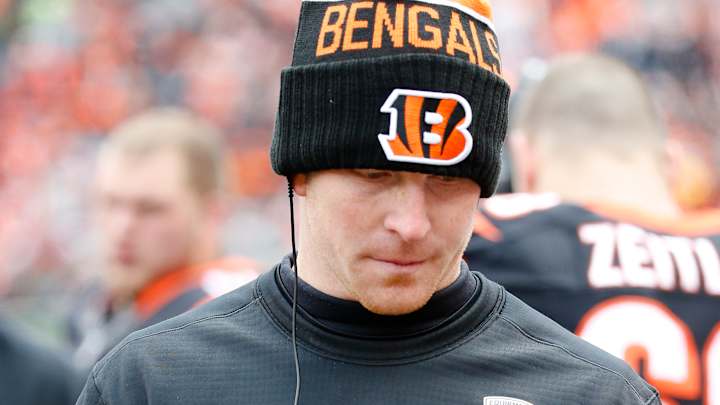 Dalton in coat, stands around during practice - a step back