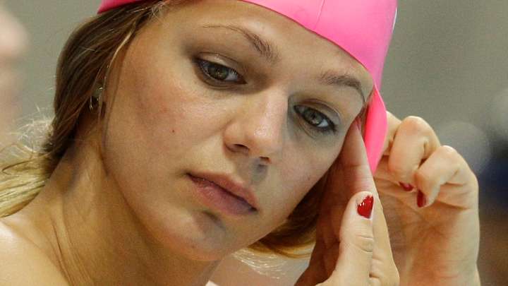 The Latest: Swimming says 7 Russians can't  compete in Rio