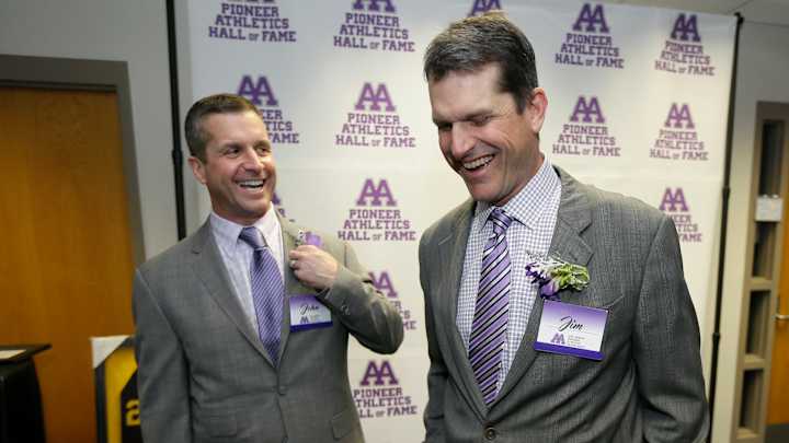 The Harbaugh brothers enjoy a day and an honor back home