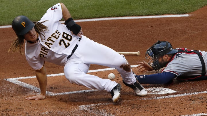 Pirates spoil Snitker's debut as manager, top Braves 12-9