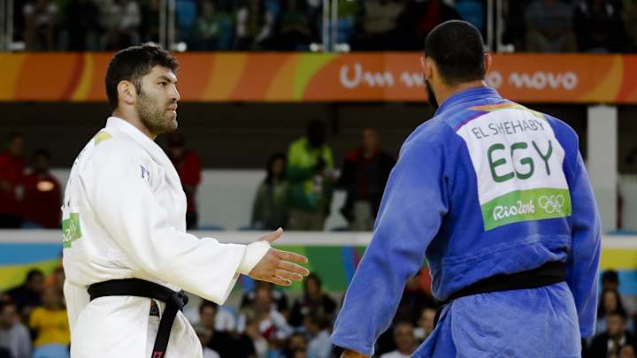 IOC: Egyptian who wouldn't shake Israeli's hand reprimanded IOC: Egyptian who wouldn't shake Israeli's hand reprimanded