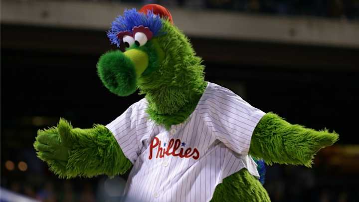 Phillie Phanatic gets up close and personal with a Nationals coach