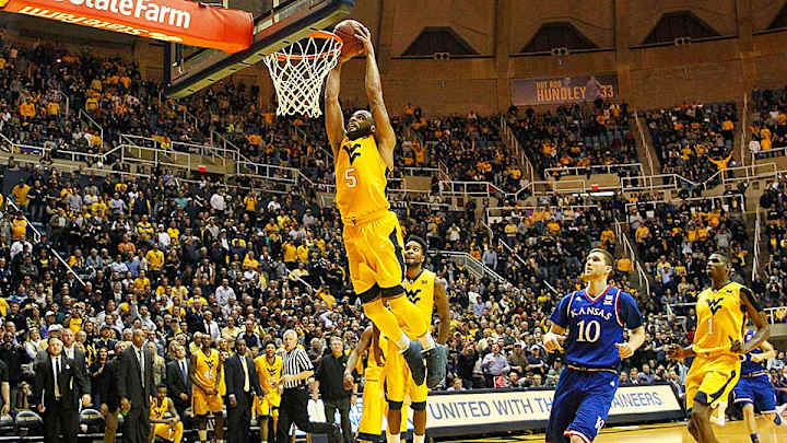 Suffocating press defense helps No. 11 West Virginia upset No. 1 Kansas