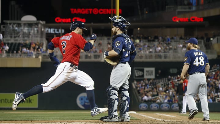 Twins top Brewers 7-4 in rain-shortened game for 4th in row