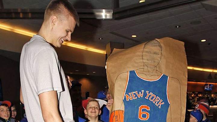 Some kids gave Kristaps Porzingis a poster taller than he is