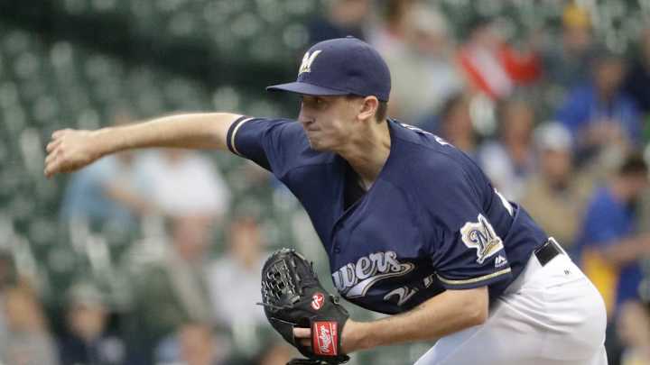 Davies shines again, Brewers hold on for 5-4 win over A's