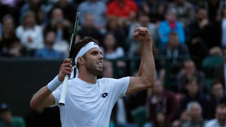 The Latest: Women's quarterfinals underway at Wimbledon
