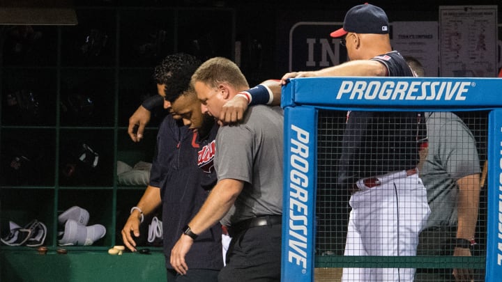 Indians DH Carlos Santana hit by foul ball into dugout, has contusion