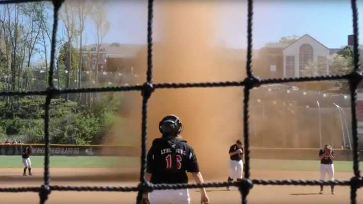 A terrifying dirt tornado sprung up in the middle of a softball game