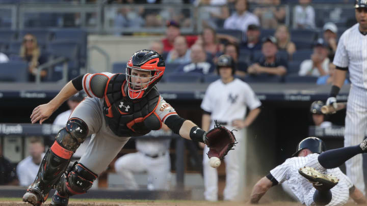 Giants catcher Posey fouls ball off foot, later leaves game
