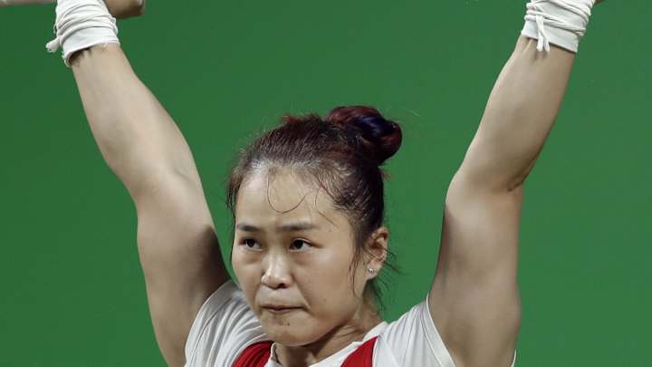 Deng lifts gold with record against field depleted by doping