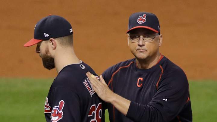 Indians exercise options manager Francona, slugger Santana
