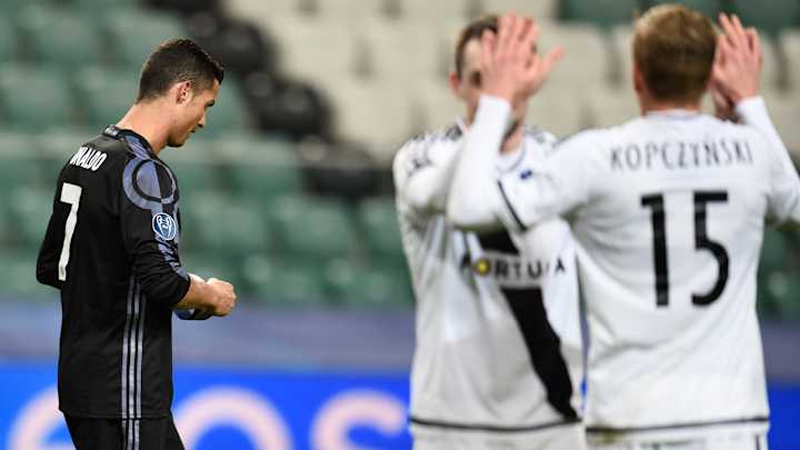 Dortmund clinches knockout berth, Real Madrid stumbles in Champions League