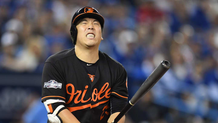 Fan throws can at Kim during wild card game