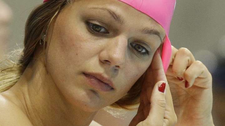 Banned Russians quietly added back to Olympic swimming