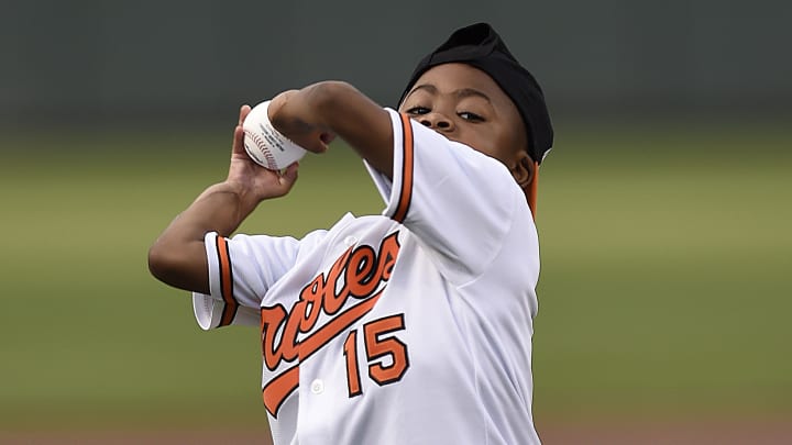 Child with double-hand transplant throws at Camden Yards