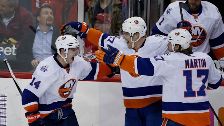 Islanders clinch playoff spot by beating Capitals in OT