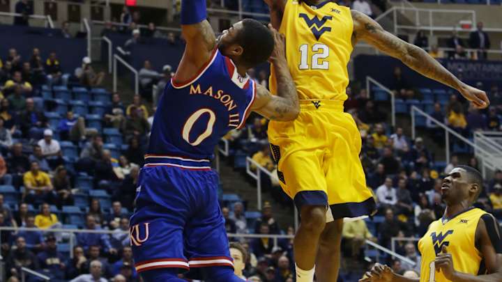No. 11 West Virginia trips up No. 1 Kansas 74-63