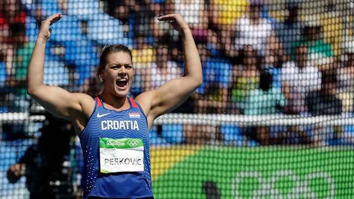 Bolt glides into 200 semis; Perkovic, Taylor defend golds