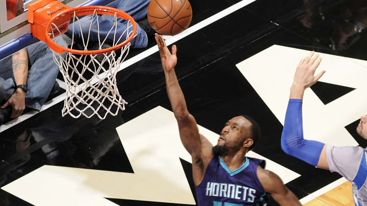 Walker leads Hornets to 120-116 OT win over Magic