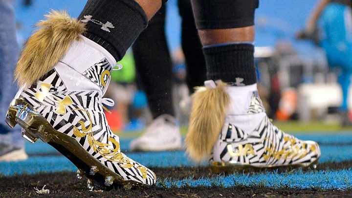 What’s up with Cam Newton’s cleats?