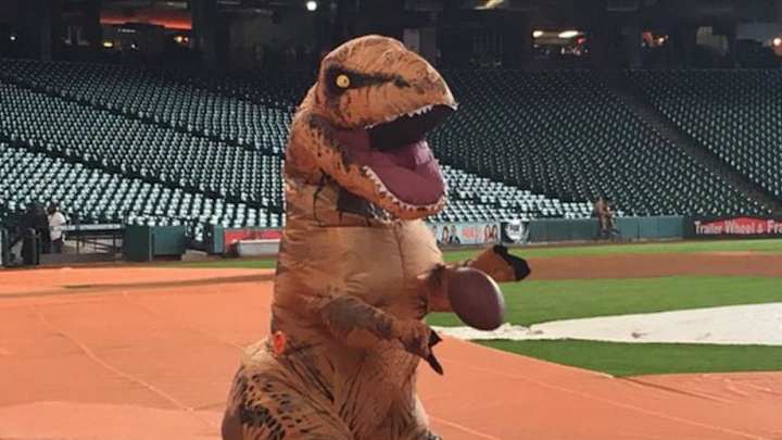 Astros’ George Springer dresses up like a dinosaur and plays football