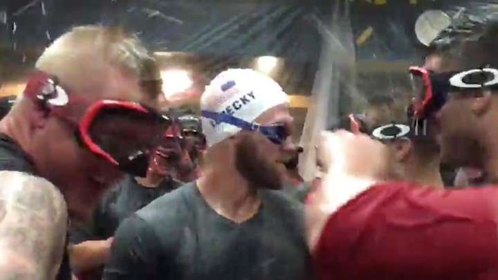 Bryce Harper celebrates Nationals’ NL East title in Katie Ledecky swim cap