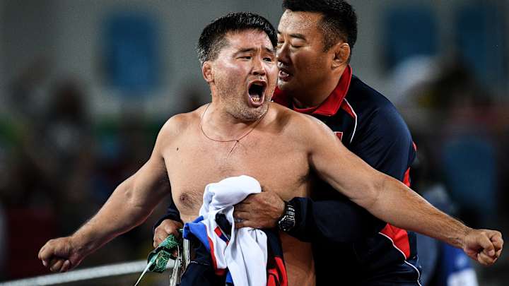 Mongolian wrestling coaches suspended three years for stripping in protest