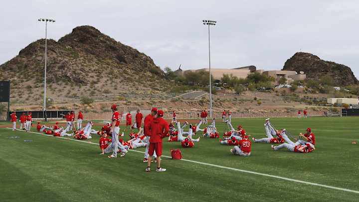 As Angels open camp, attention on those who aren't there