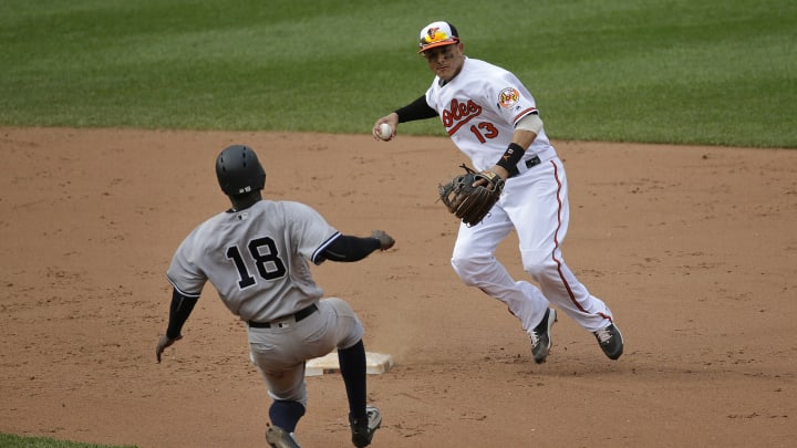 After rain, Orioles rally to beat Chapman and Yankees 3-1
