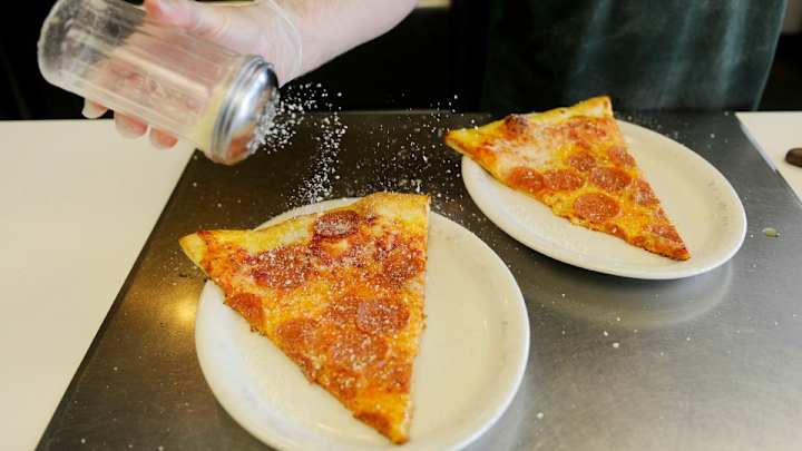 Hawks fan launches ambidextrous pizza attack on Kiss Cam