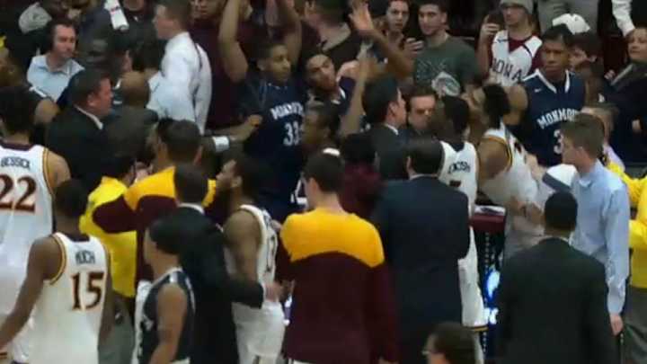 Iona’s Jordan Washington slaps Monmouth’s Chris Brady after game Iona’s Jordan Washington slaps Monmouth’s Chris Brady after game