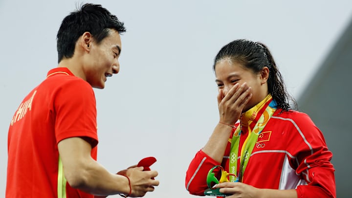 Watch: Chinese divers get engaged at medal ceremony