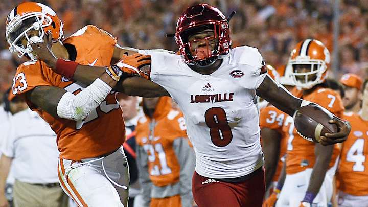 Louisville bans football players from signing autographs Louisville bans football players from signing autographs