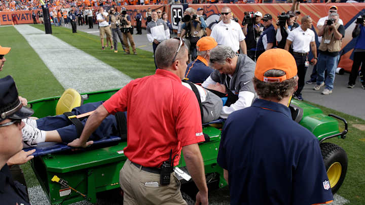 Broncos defensive coordinator upended, carted off field