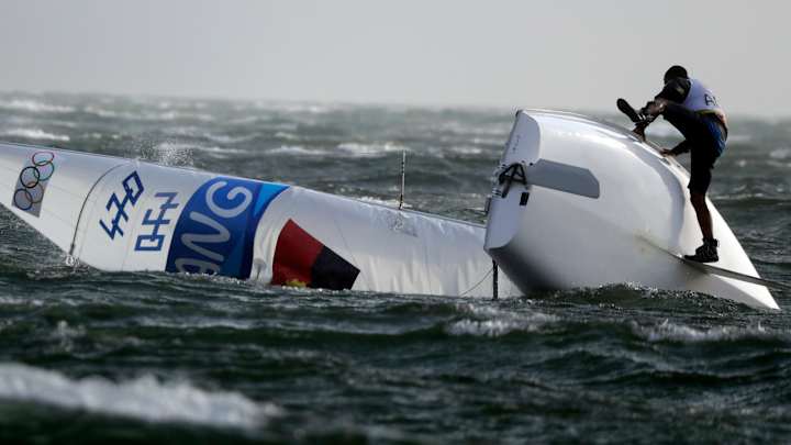 Foul weather hits Olympics, on the track and at sailing Foul weather hits Olympics, on the track and at sailing