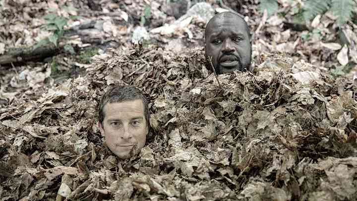 Watch Shaquille O'Neal somehow hide under a pile of leaves