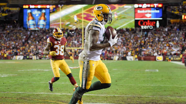 After slow start, Rodgers, Packers overwhelm Redskins 35-18