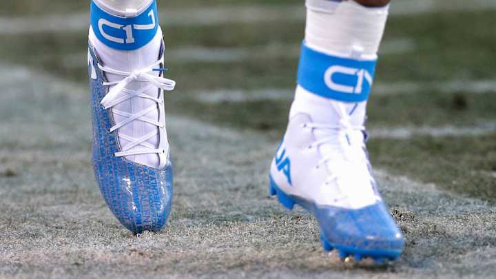 Cam Newton warms up in cleats covered with his teammates’ names Cam Newton warms up in cleats covered with his teammates’ names
