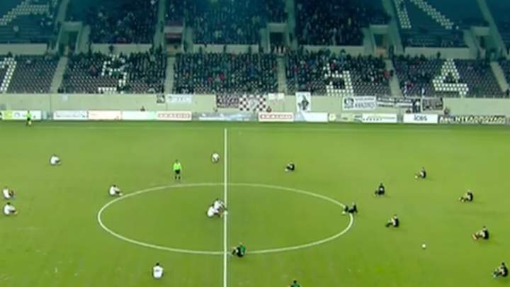 Watch: Players in Greece protest refugee treatment, sit after kickoff Watch: Players in Greece protest refugee treatment, sit after kickoff