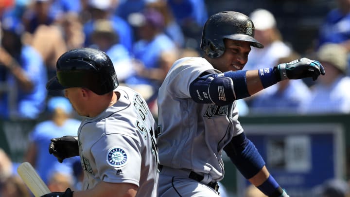 Cano, Lind homer to help Mariners hold off Royals, 8-5