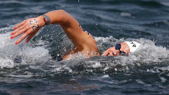 France’s Aurelie Muller loses silver after being disqualified in 10-kilometer swim