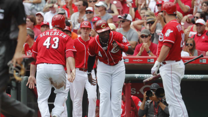 Phillips leads Reds over Cardinals 7-0 for rare series win