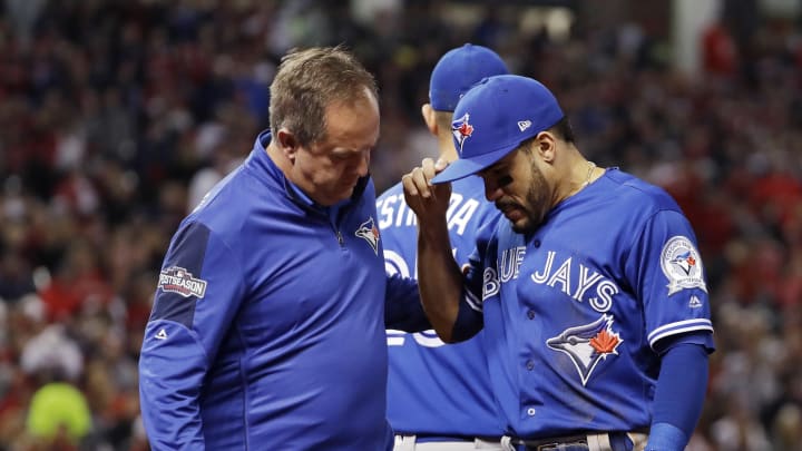 Blue Jays 2B Travis leaves ALCS Game 1 with knee injury Blue Jays 2B Travis leaves ALCS Game 1 with knee injury